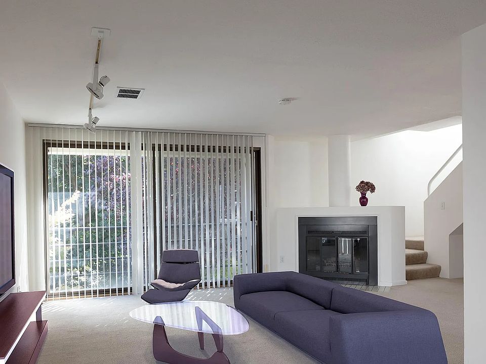 Living room with wood burning fireplace