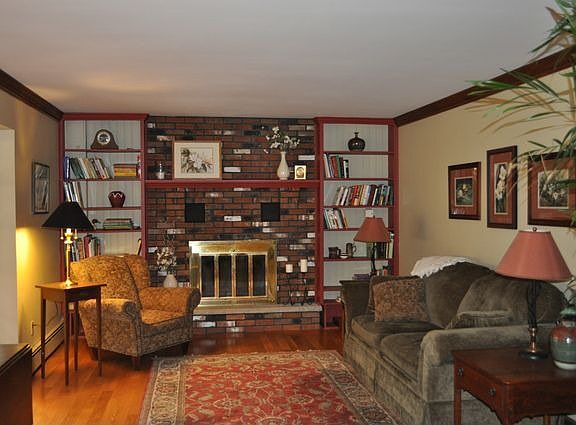 FAMILYROOM W/BRICK FIREPLANCE.