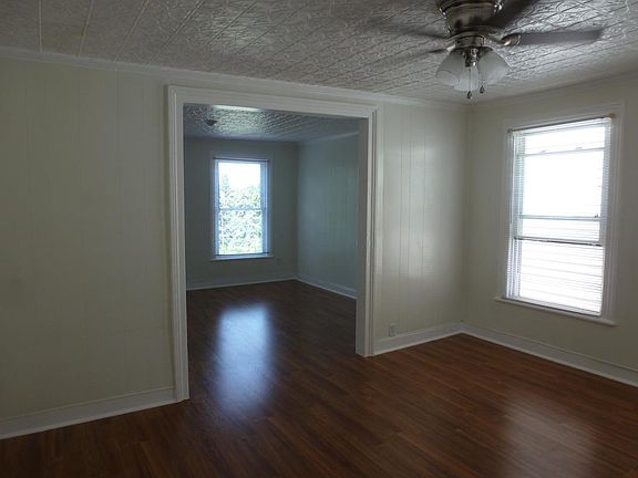 View from Master BR doorway out into both Living Rooms