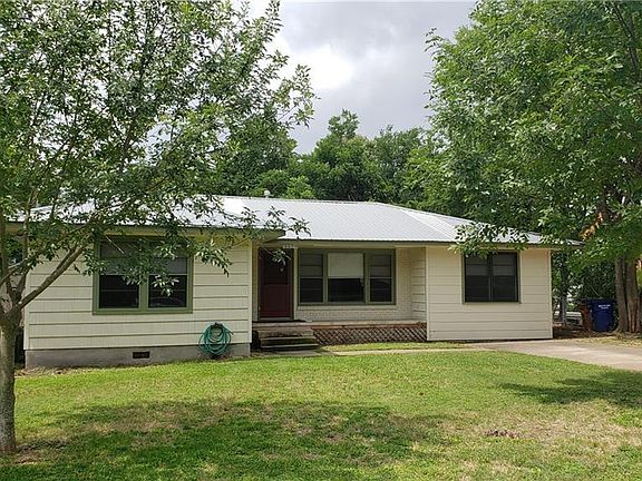 NICE FRONT YARD WITH TREES. FRONT PORCH