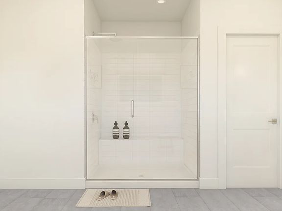 Primary bath with glass shower enclosure