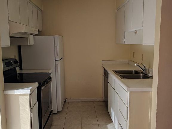 kitchen with new fridge and dishwasher