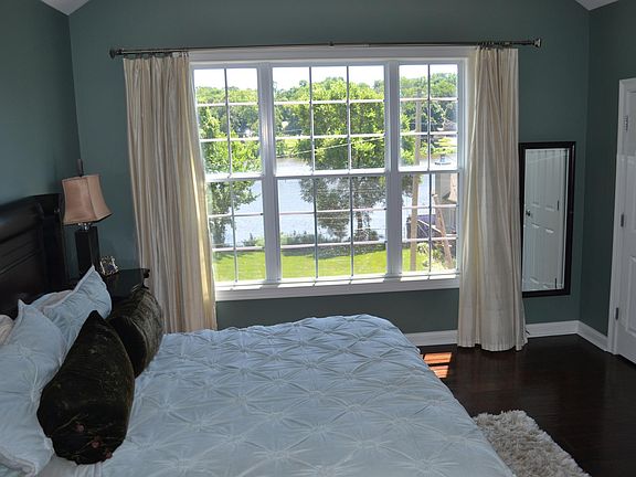 Vaulted Master Bedroom Hardwood Floors River Views