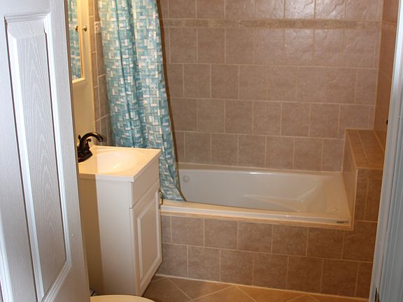 private bathroom with jetted tub