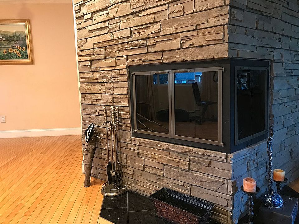 dual rooms fireplace, stone