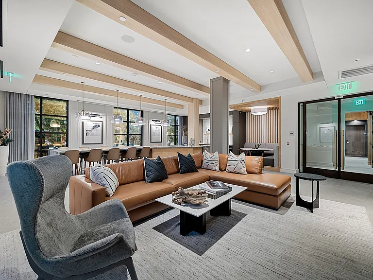Resident lounge with leather sectional and designer seating