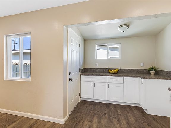 New custom kitchen with beautiful quartz counter tops, new floors & stainless steel appliances.