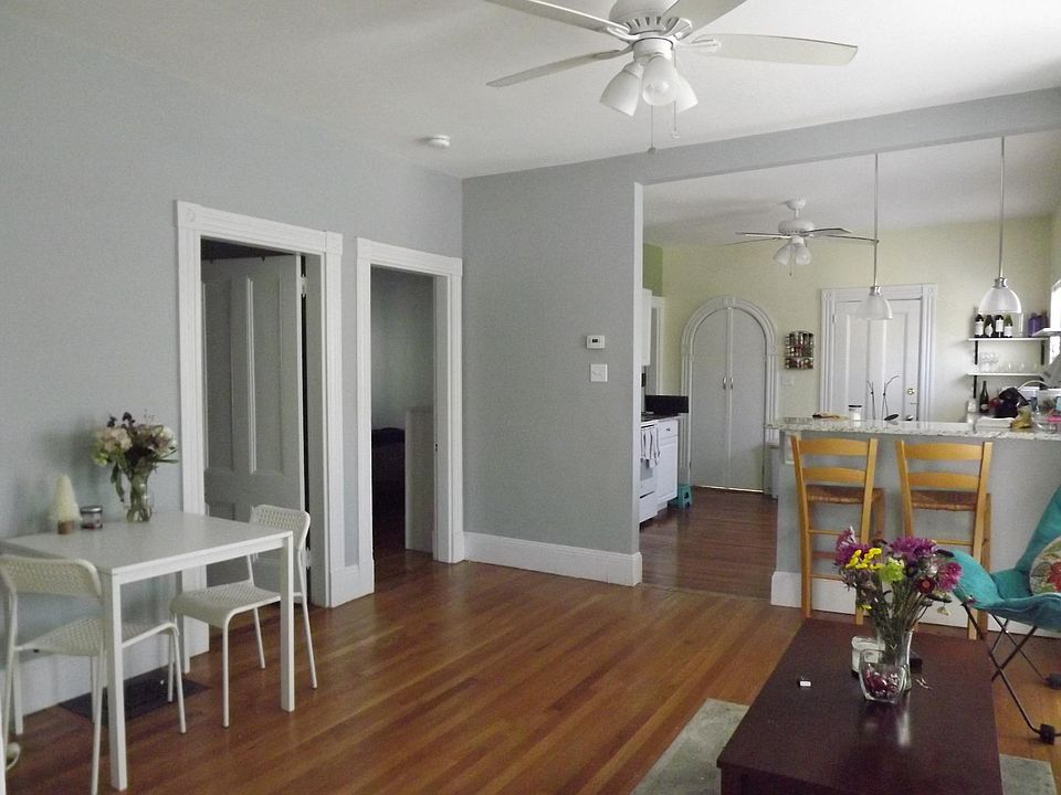 Open living room and high top bar eating area.