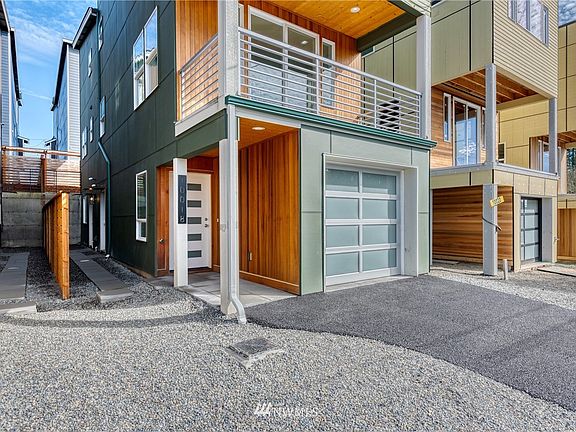 The covered entrance is adorned with cedar paneling and knotty pine ceiling with recessed light as you enter through a frosted glass paned door. Convenient 2-car tandem garage with additional driveway parking.