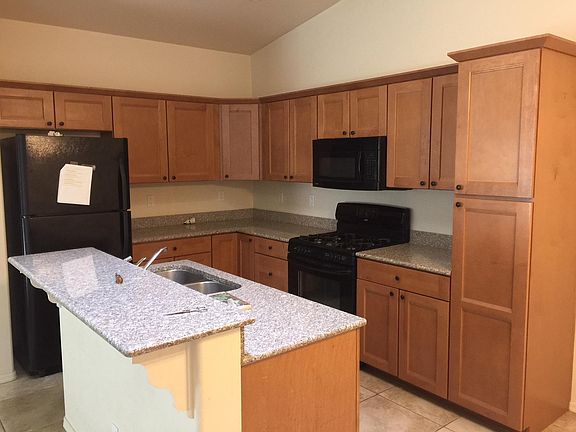 Though black in the photo, the kitchen appliances have recently been upgraded to stainless steel.