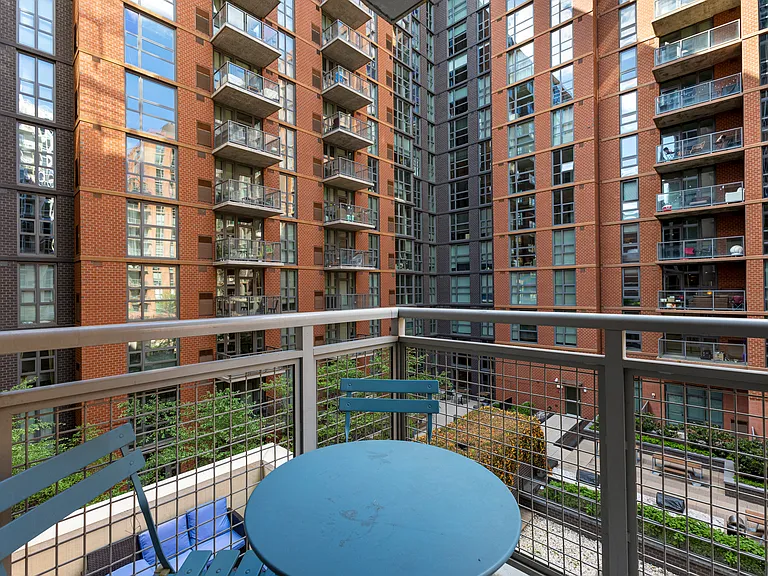 Step outside to your private balcony, the perfect spot for a morning coffee or an evening drink while taking in the vibrant urban courtyard views.
