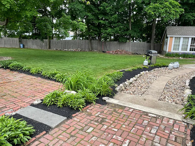 Patio and backyard of property
