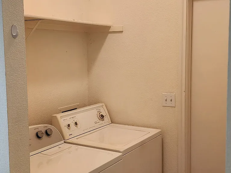 Laundry room adjacent to kitchen