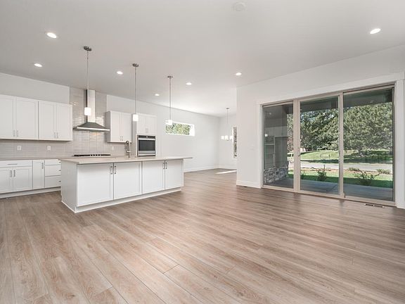 Open main level home design with expansive sliding glass doors