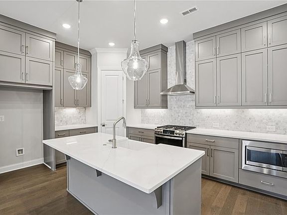 A gorgeous kitchen with GE profile appliances and Bell Cabinetry.