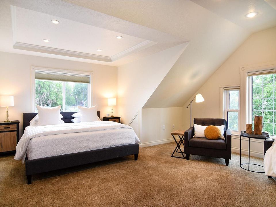 Loft bedroom with room-darkening shades.