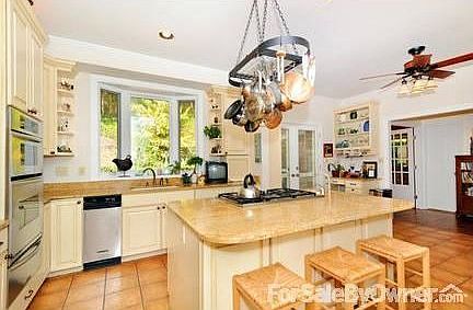 Kitchen
						:
						Eat in kitchen opens to dining room and family room with fireplace