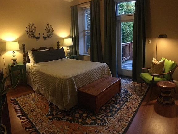 Master Bedroom with 2nd floor Deck directly off it. Unit comes unfurnished -- all furniture shown is the current tenant's and does not come with the unit.