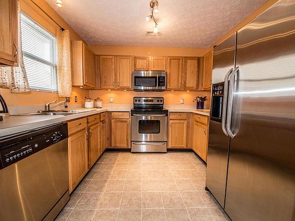 View of the well-equipped kitchen from the dining area