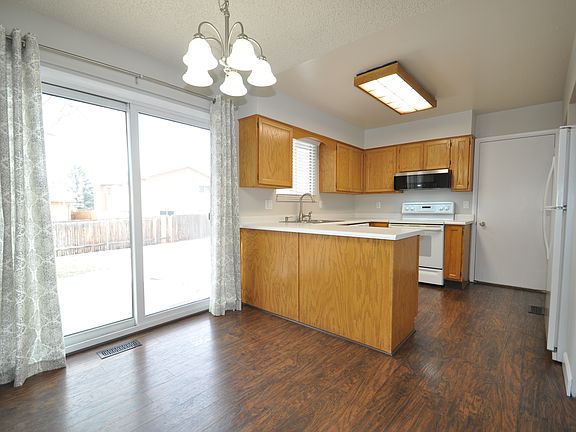 Overall view of dining room and kitchen.