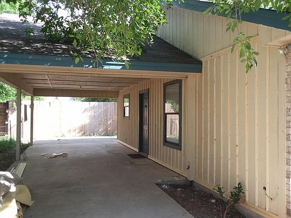 covered side patio before painting