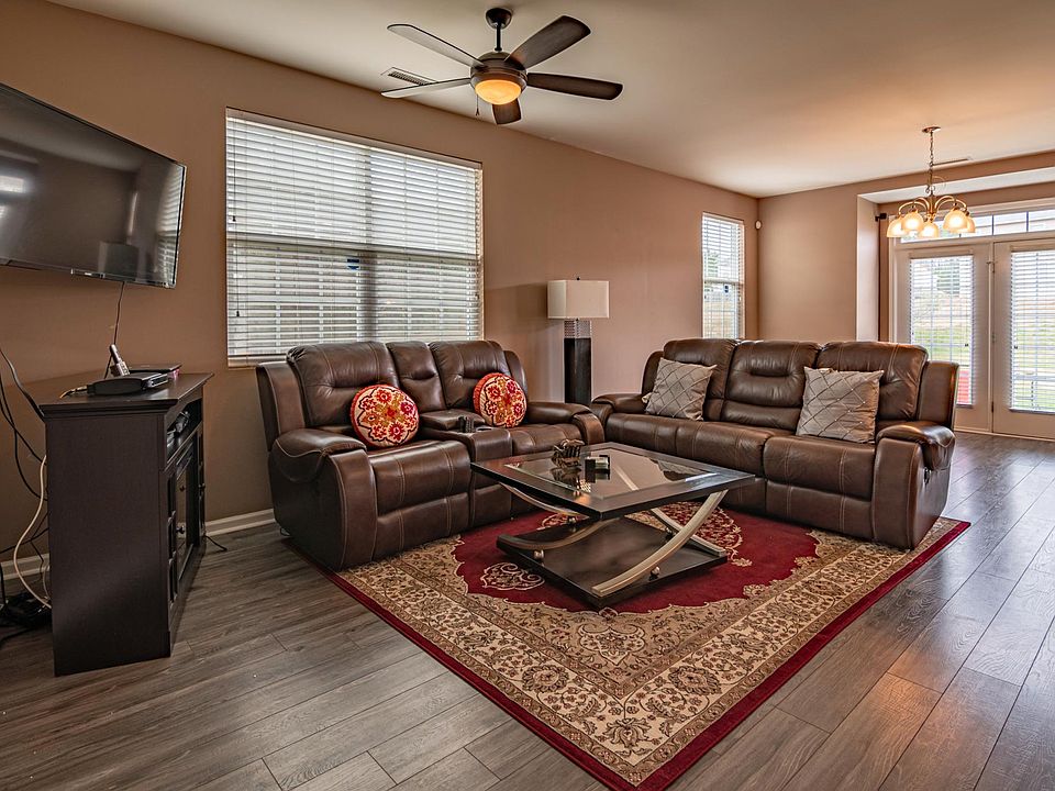 New floor in family room with ceiling fan