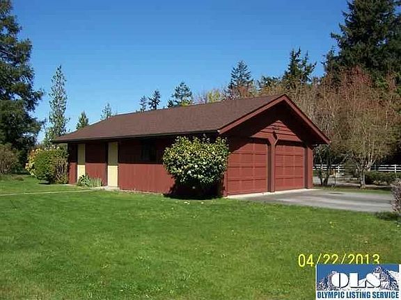 The detached two car garage houses a workshop area and a wood storage area.  The original garage was converted into living space.