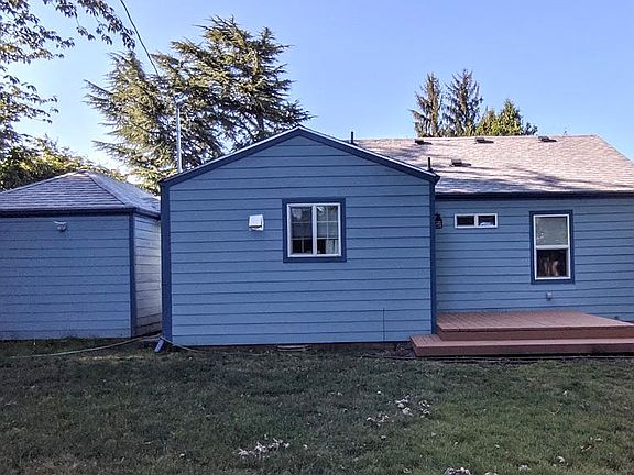 Back of house, garage on the left, kitchen in the center, deck and bedroom on the right.