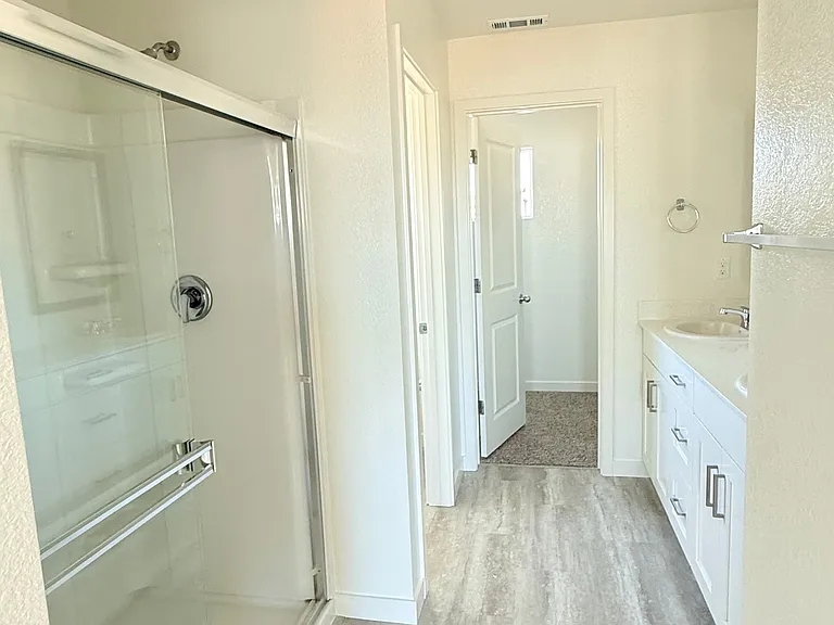 Spacious master bathroom with his and hers areas