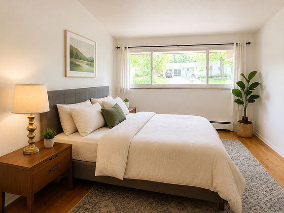 West facing bedroom with vaulted ceiling.