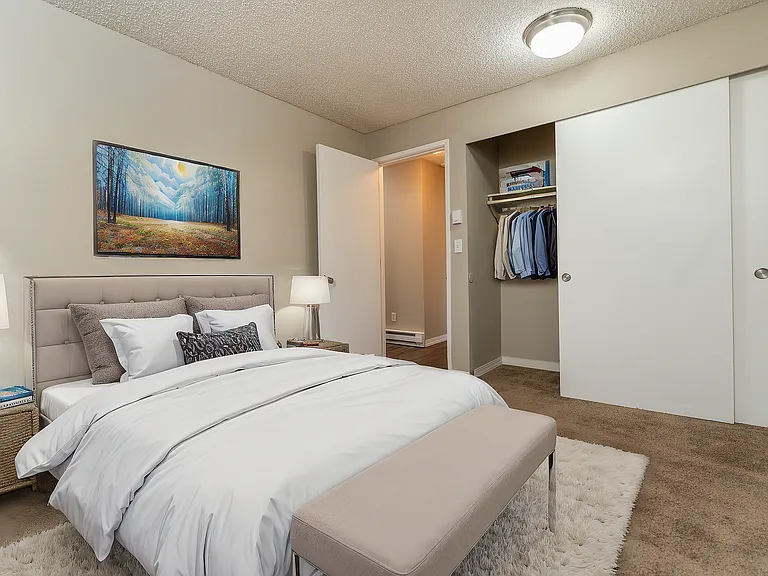 Explore the tranquility of this elegantly designed bedroom, perfect for relaxation and comfort.