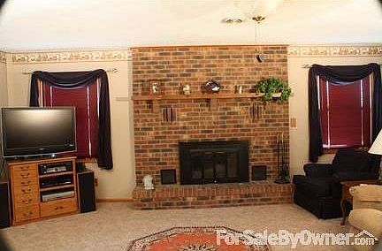 Living Room
						:
						Has wood burning fireplace with gas starter