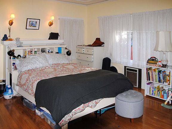 Bedroom with lots of windows.