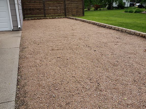 Gravel driveway beside the garage