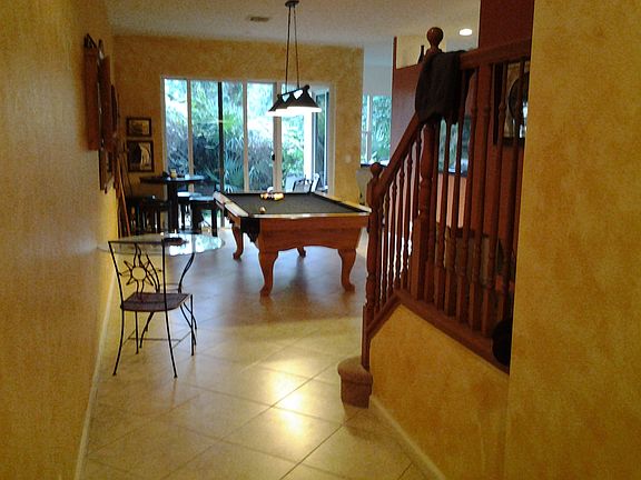 Front door view into living area to patio