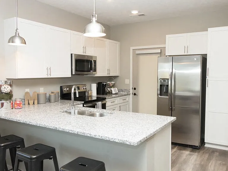 Our spacious kitchens offer modern appliances and ample counter space, perfect for cooking and entertaining.
