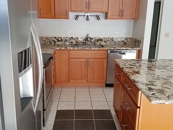 Detail of kitchen with stainless steel appliances & granite