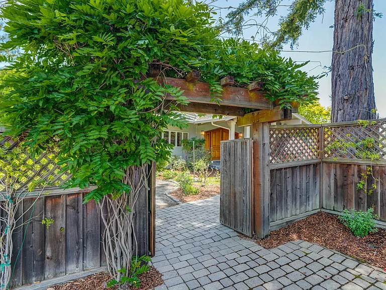 Spacious multi-level 8,000 square foot 5-bedroom 5.5-bath house situated in a sprawling one-acre lot in Los Altos Hills featuring various entertainment spaces.