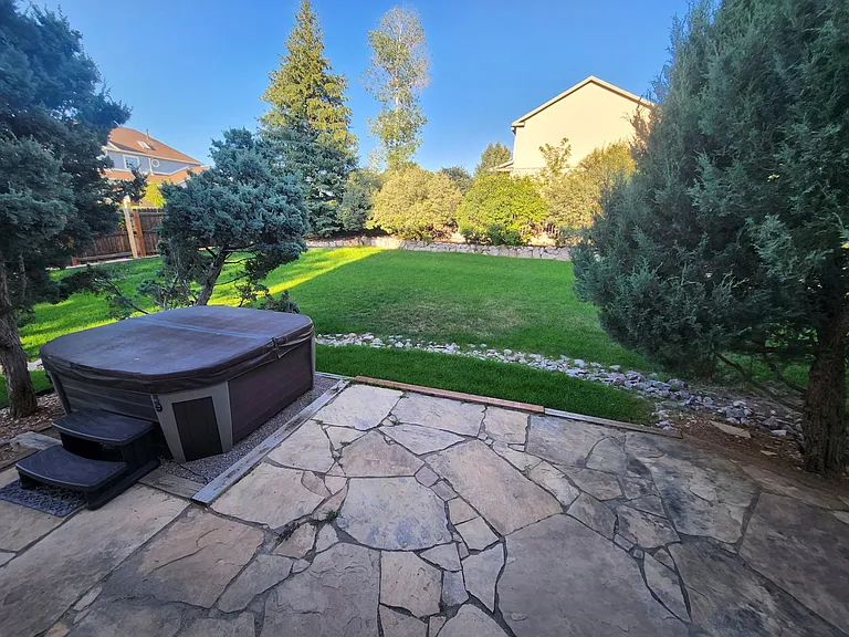 Huge backyard with private flagstone patio and hottub