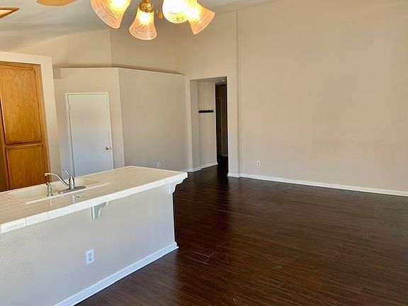 Enter family room and kitchen. Hallway into bedrooms.
