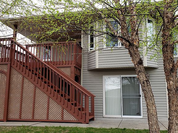 Back of house with deck
