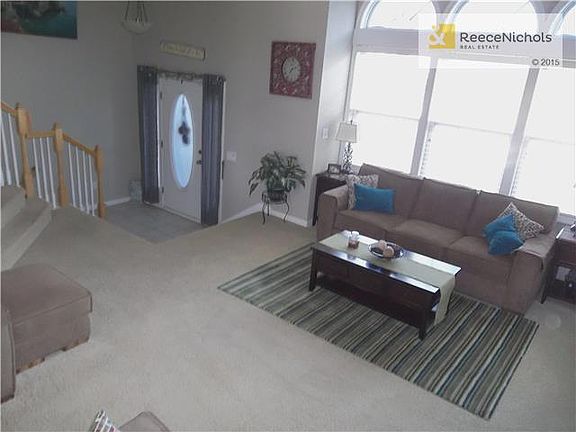 View looking down into the Greatroom from the Dining area with the tiled entryway.