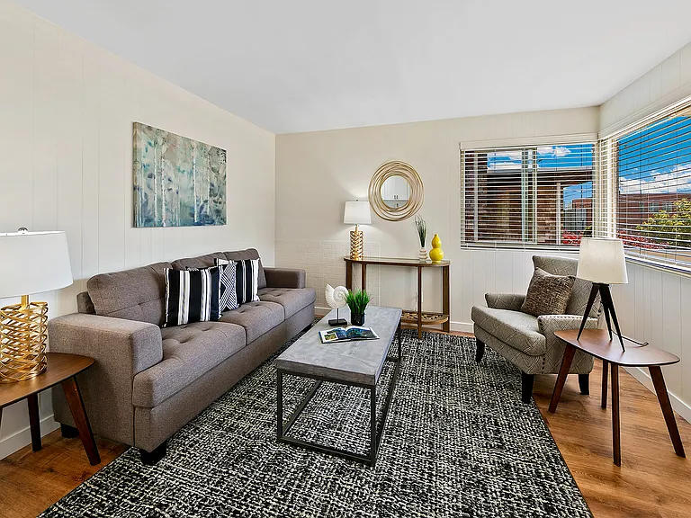 Top-floor end unit with windows on the east, south, and west sides that bathe the interior in natural light. Newer 2" blinds.