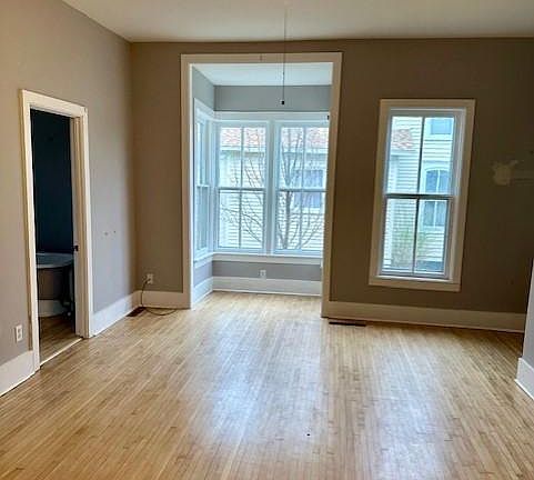 FR showing alcove, Bath is to the left. Alcove is deep center of frame, full bath on left edge, entrance is far right edge of photo as well as the steps leading to bedrooms.