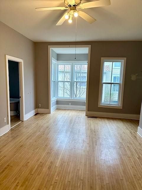 FR showing alcove, Bath is to the left. Alcove is deep center of frame, full bath on left edge, entrance is far right edge of photo as well as the steps leading to bedrooms.