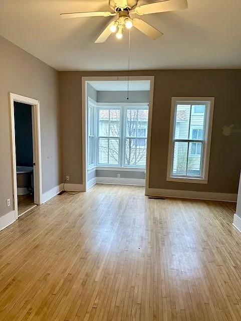 FR showing alcove, Bath is to the left. Alcove is deep center of frame, full bath on left edge, entrance is far right edge of photo as well as the steps leading to bedrooms.
