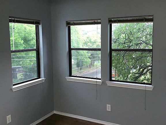 Sunny dining or office area adjoining living room and adjacent to kitchen