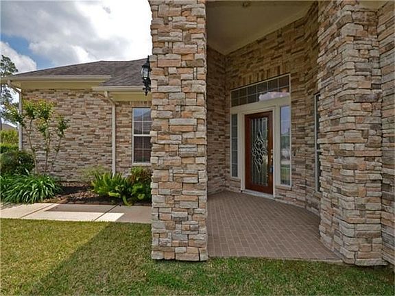 Large covered front porch with brick pavers introduce the front entry of this home. Full leaded glas