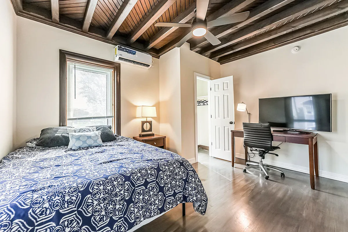 View from separate entrance to the front of the house. Large ceiling fan with remote. Smart TV. Enjoy the craftsman ceiling. - Dirby St