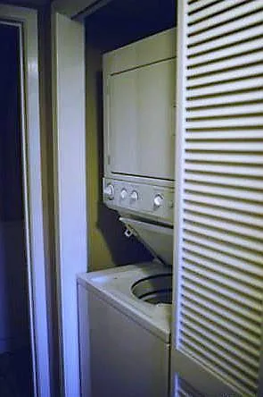 washer & dryer in storage closet downstairs